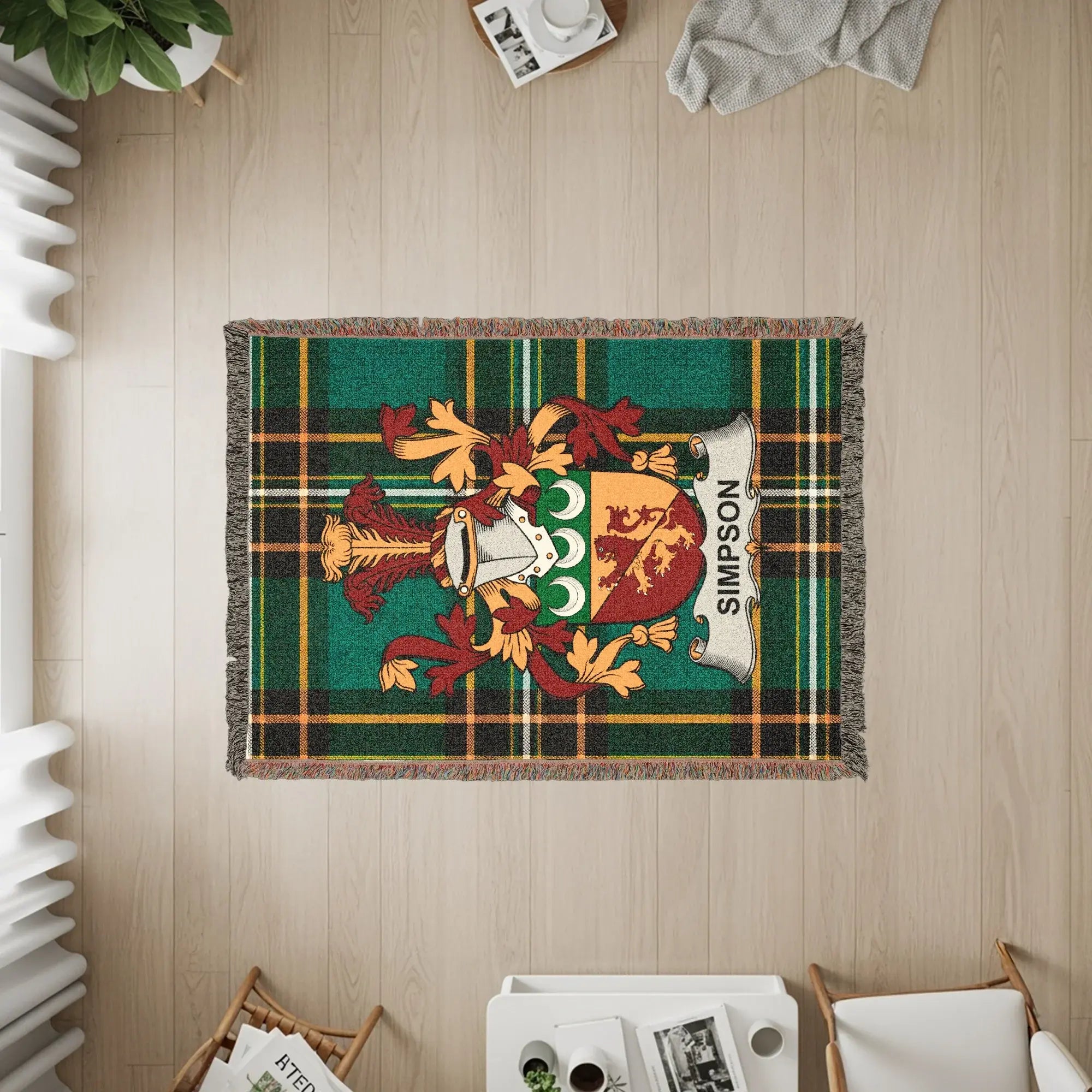 Simpson family crest on a green tartan plaid woven throw blanket.