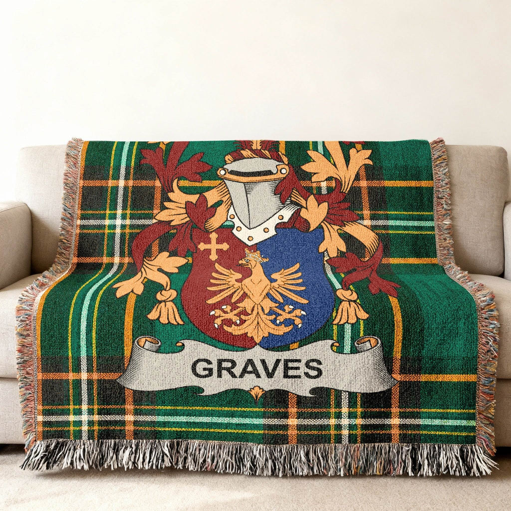 Green plaid woven blanket with family crest displaying "GRAVES" on a banner.