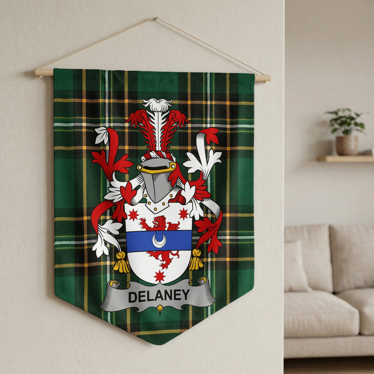 Delaney family crest banner on green tartan fabric with medieval helmet and shield.