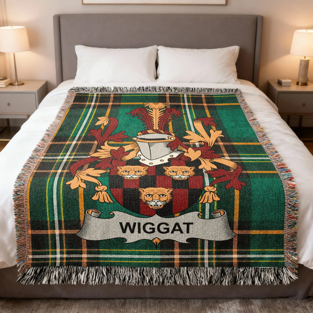 WigGat family crest on a tartan plaid blanket displayed on a bed.
