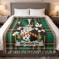 McWorth family crest on a green plaid throw blanket.