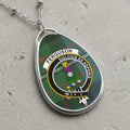 Ferguson clan Scottish tartan necklace with clan crest and Dulcius Ex Asperis motto on tartan background