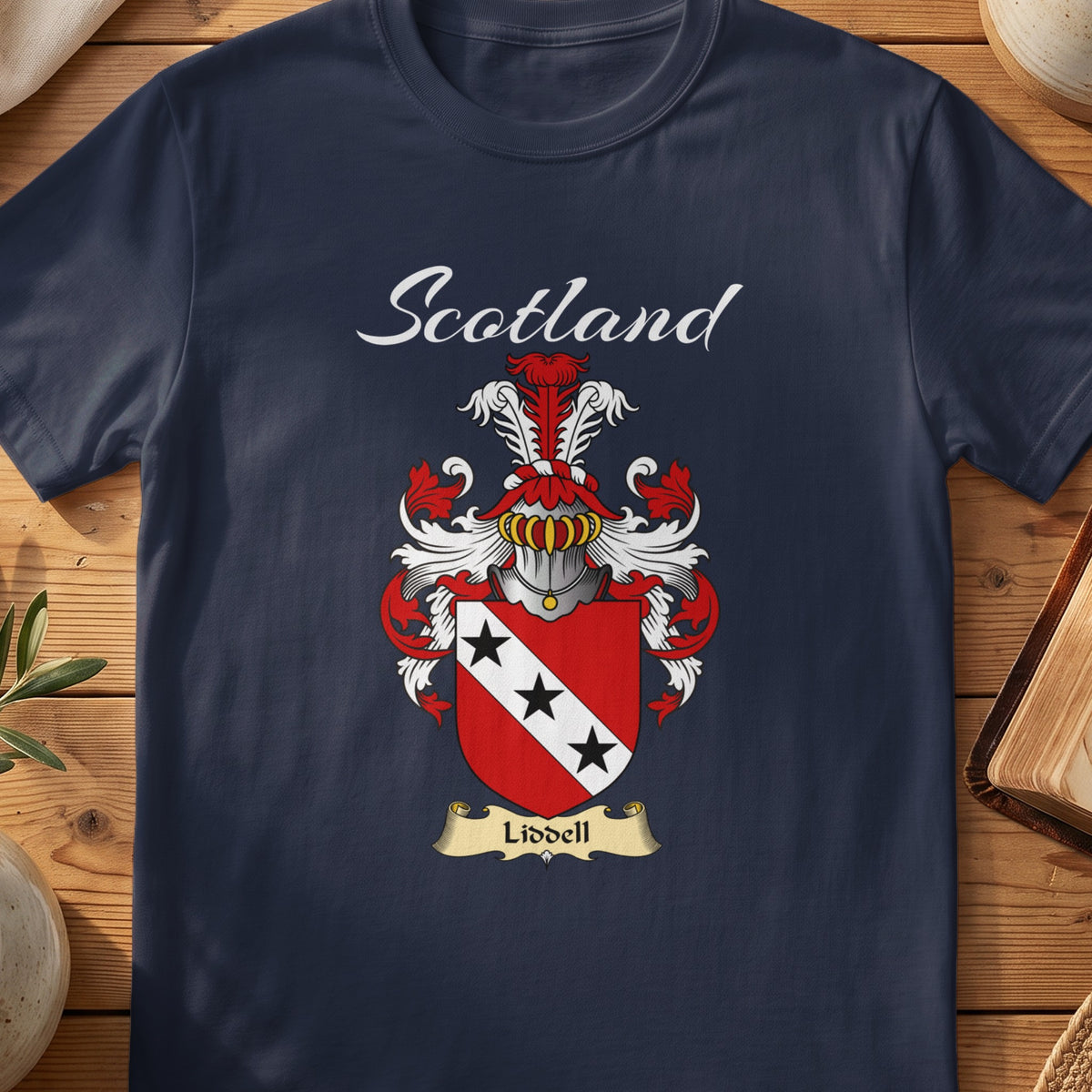 Navy Liddell family shield T-shirt featuring a white diagonal band carrying three black stars