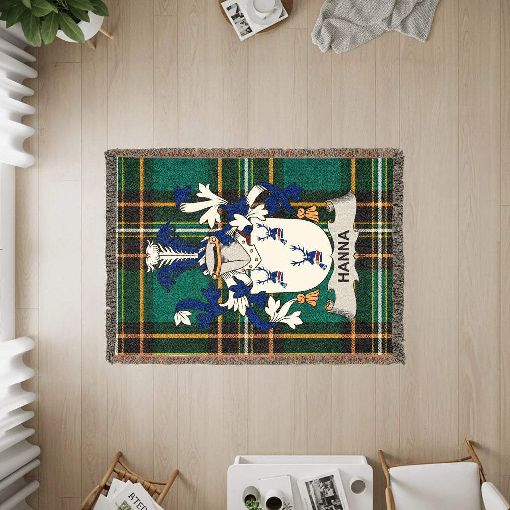 Hanna family crest on a tartan woven throw blanket.