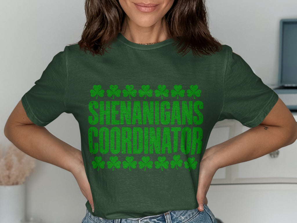 Green St Patrick's Day T-shirt featuring the “Shenanigans Coordinator” shamrock design.
