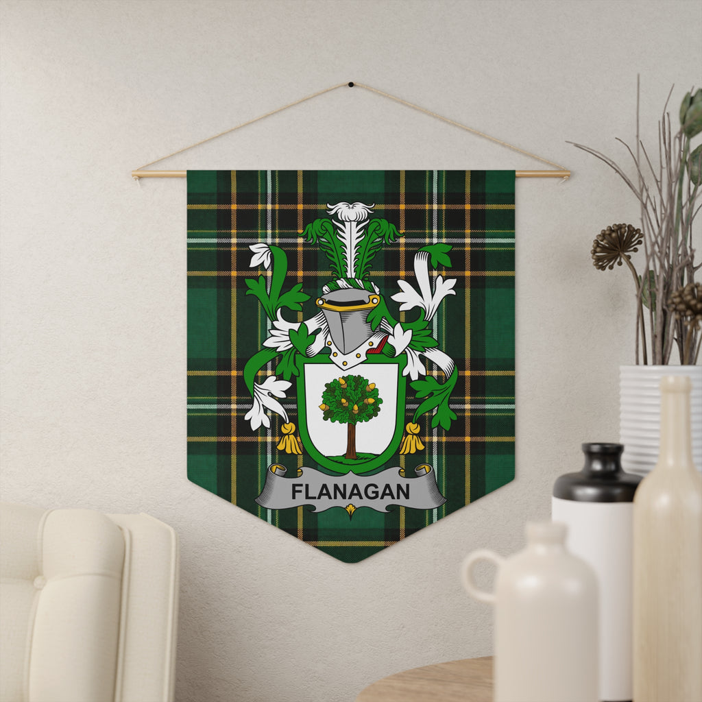 Flanagan family crest banner with green plaid background and silver shield with a tree.