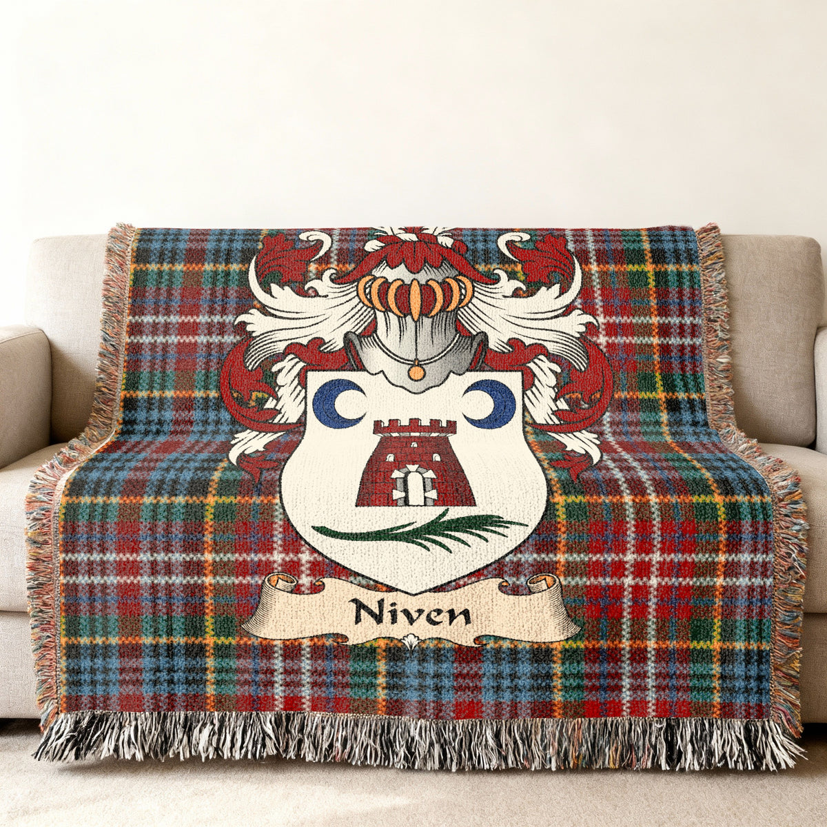 Niven Scottish family shield woven blanket on a Caledonia tartan background