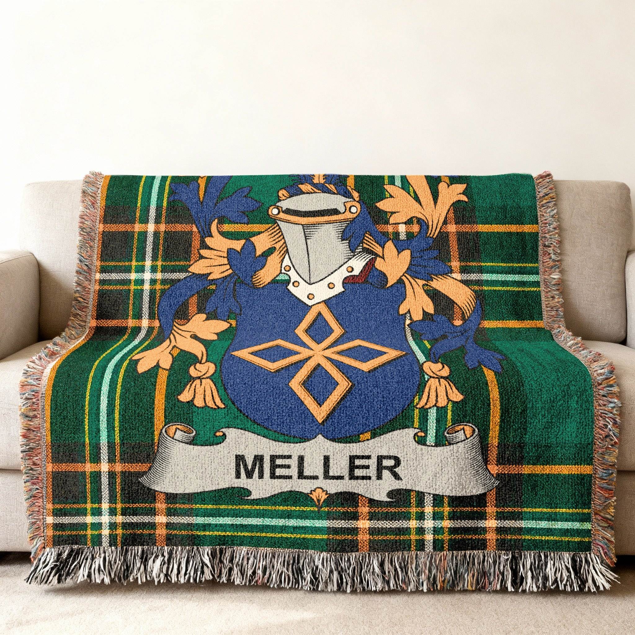 Green plaid throw blanket featuring the Meller family crest with a blue shield.