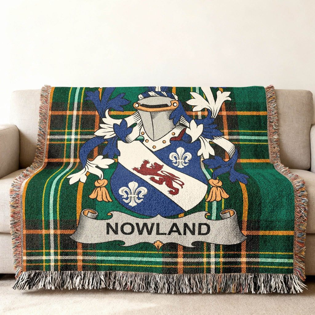Nowland family crest woven into a green plaid throw blanket.