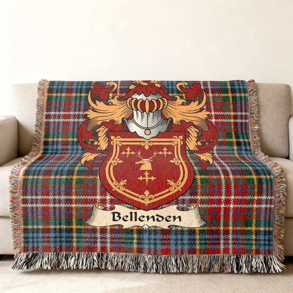 Bellenden Scottish family shield woven blanket with Caledonia tartan background on a sofa