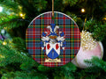 Neilson Scottish clan ceramic ornament with family crest on a Caledonia tartan background, hanging on a Christmas tree
