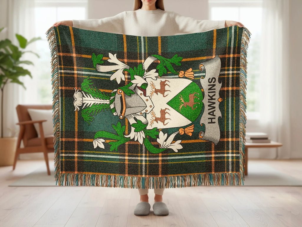 Plaid blanket with Hawkins crest featuring deer and heraldic elements.
