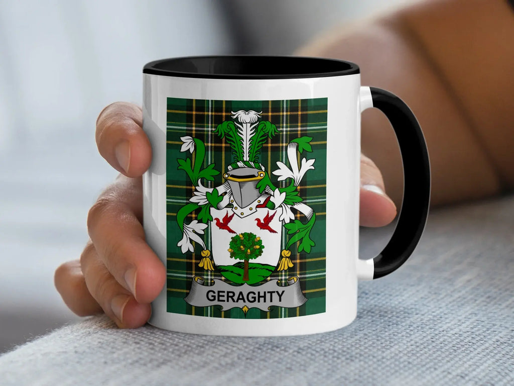 White mug with black rim featuring a green tartan coat of arms for "GERAGHTY".