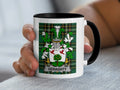 White mug with black rim featuring a green tartan coat of arms for "GERAGHTY".