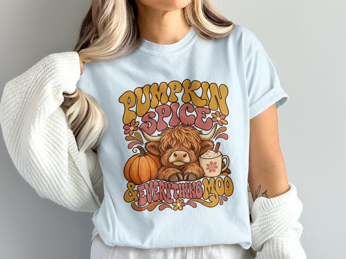 Model wearing the Pumpkin Spice & Everything Moo Highland cow Comfort Colors T-shirt in Chambray