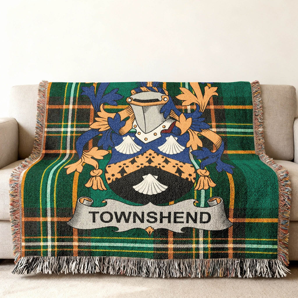 Woven throw blanket with green plaid and Townshend family crest.