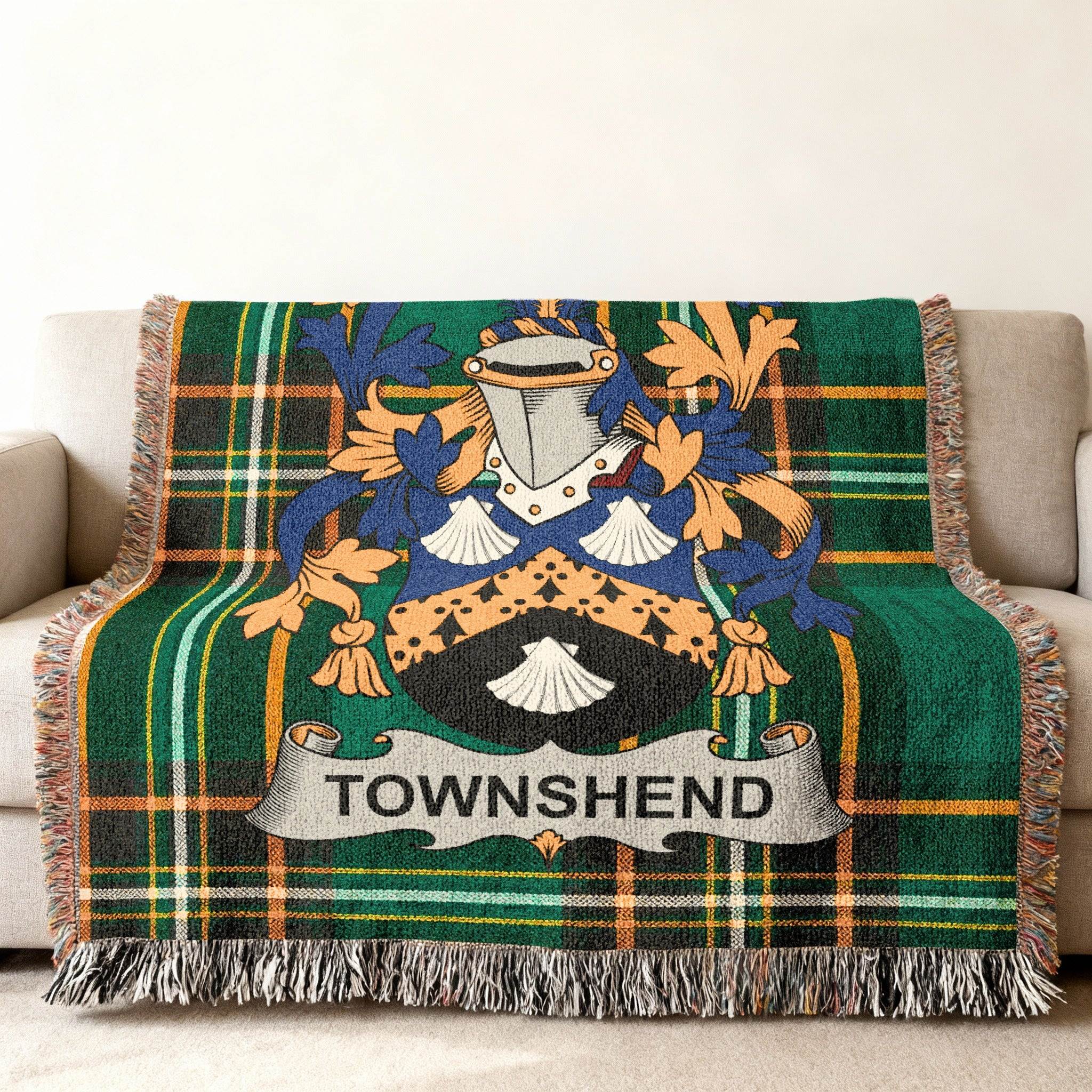 Woven throw blanket with green plaid and Townshend family crest.