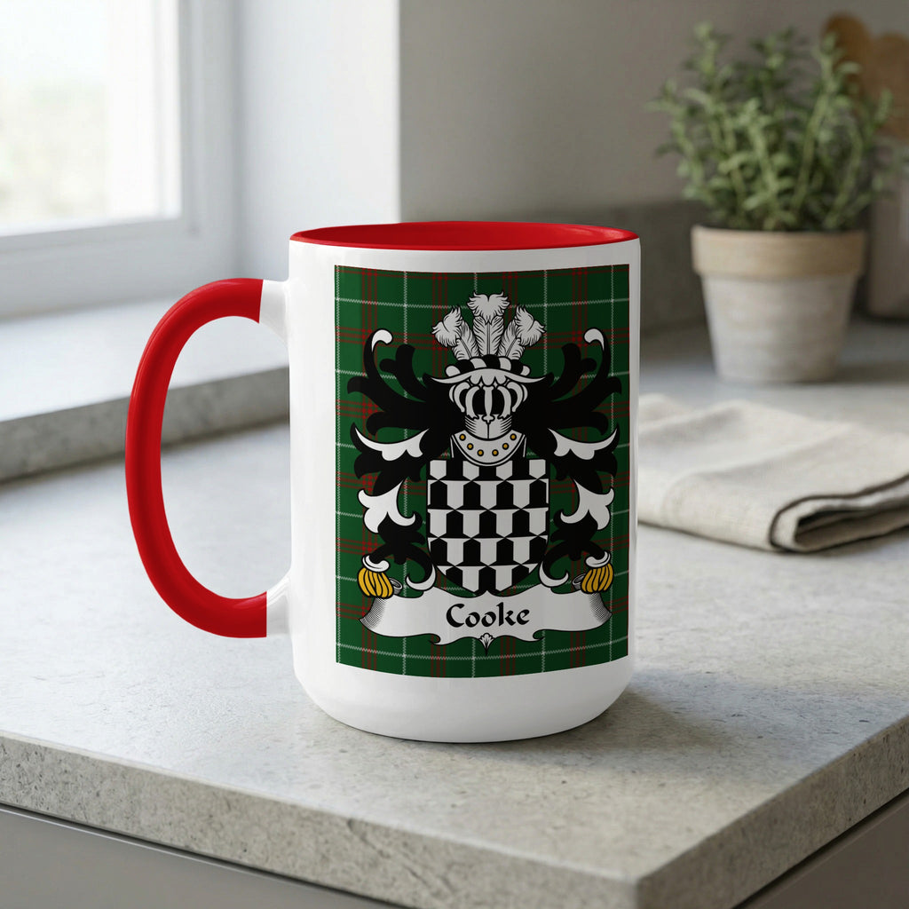 White mug with red handle, displaying a green tartan and the Cooke family crest.