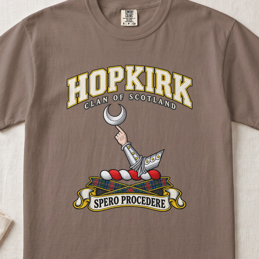 Hopkirk Scottish clan T-shirt in Espresso, front view with an armoured arm holding a silver crescent and motto banner.