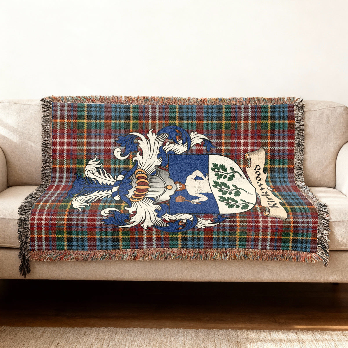Kirkwood Scottish woven blanket with family shield and Caledonia tartan background