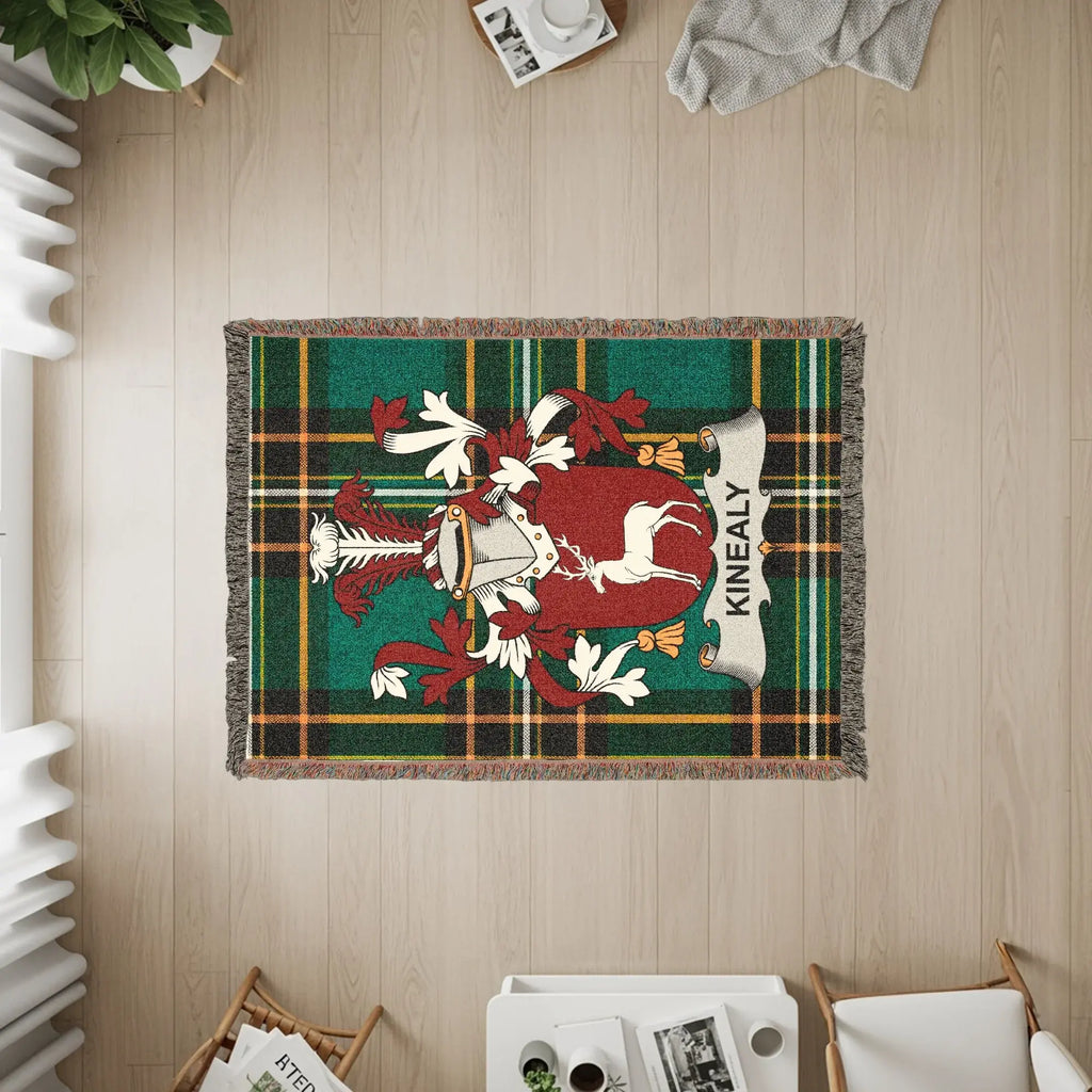 Green plaid throw blanket with Kinealy family crest.
