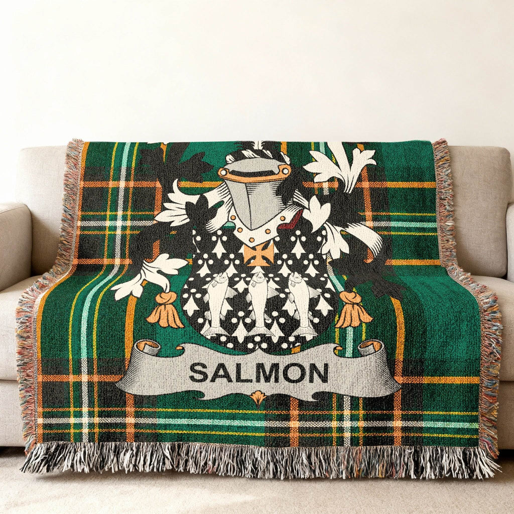 Tartan blanket with salmon coat of arms and family name.