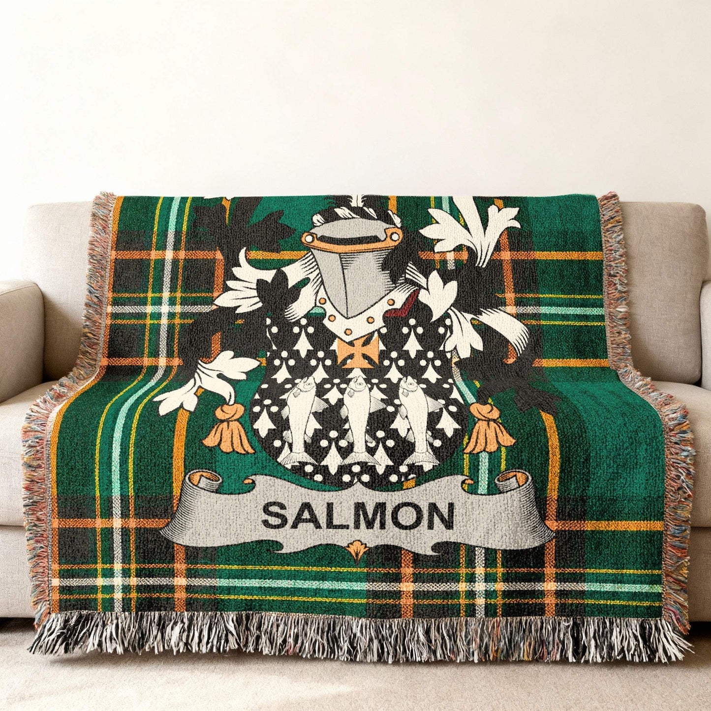 Tartan blanket with salmon coat of arms and family name.