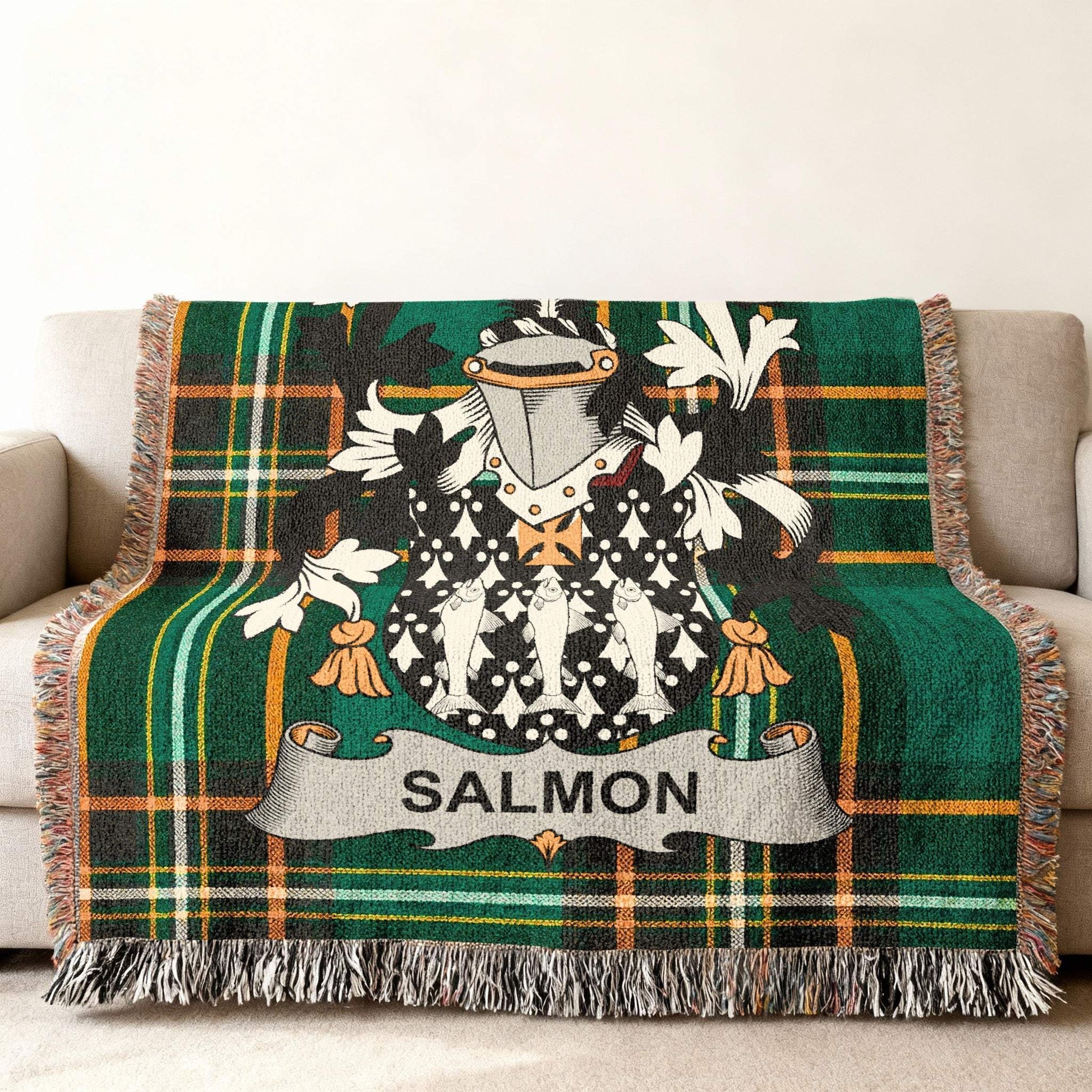 Tartan blanket with salmon coat of arms and family name.