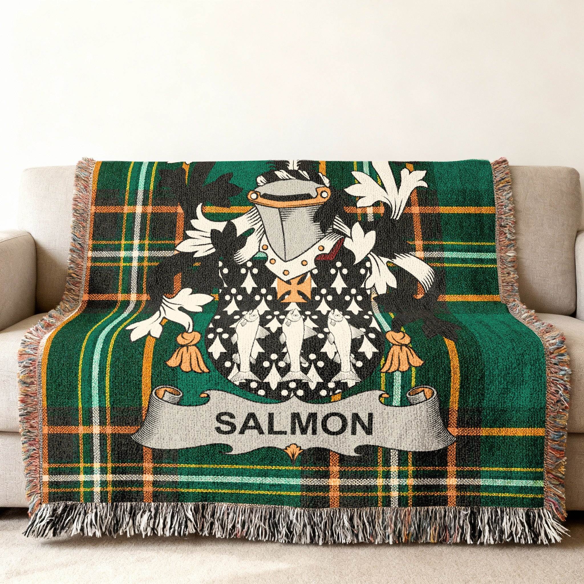 Tartan blanket with salmon coat of arms and family name.
