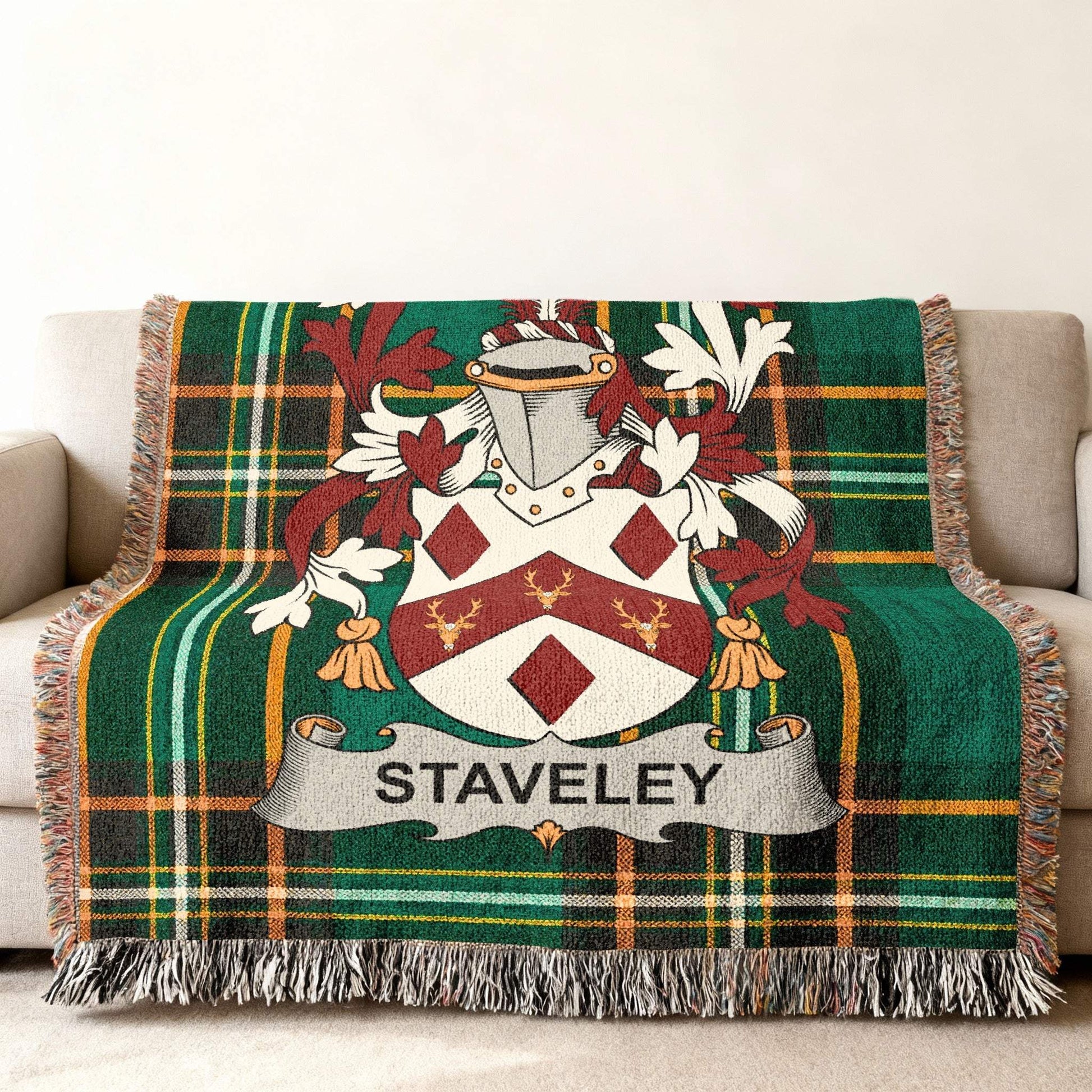 Green tartan blanket with the STAVELEY family crest.