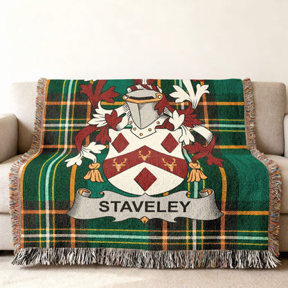 Green tartan blanket with the STAVELEY family crest.