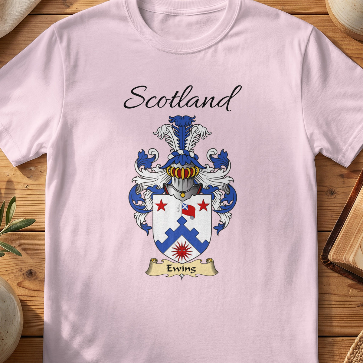 Light Pink Ewing Scottish family shield T-shirt featuring a blue stepped chevron with red stars