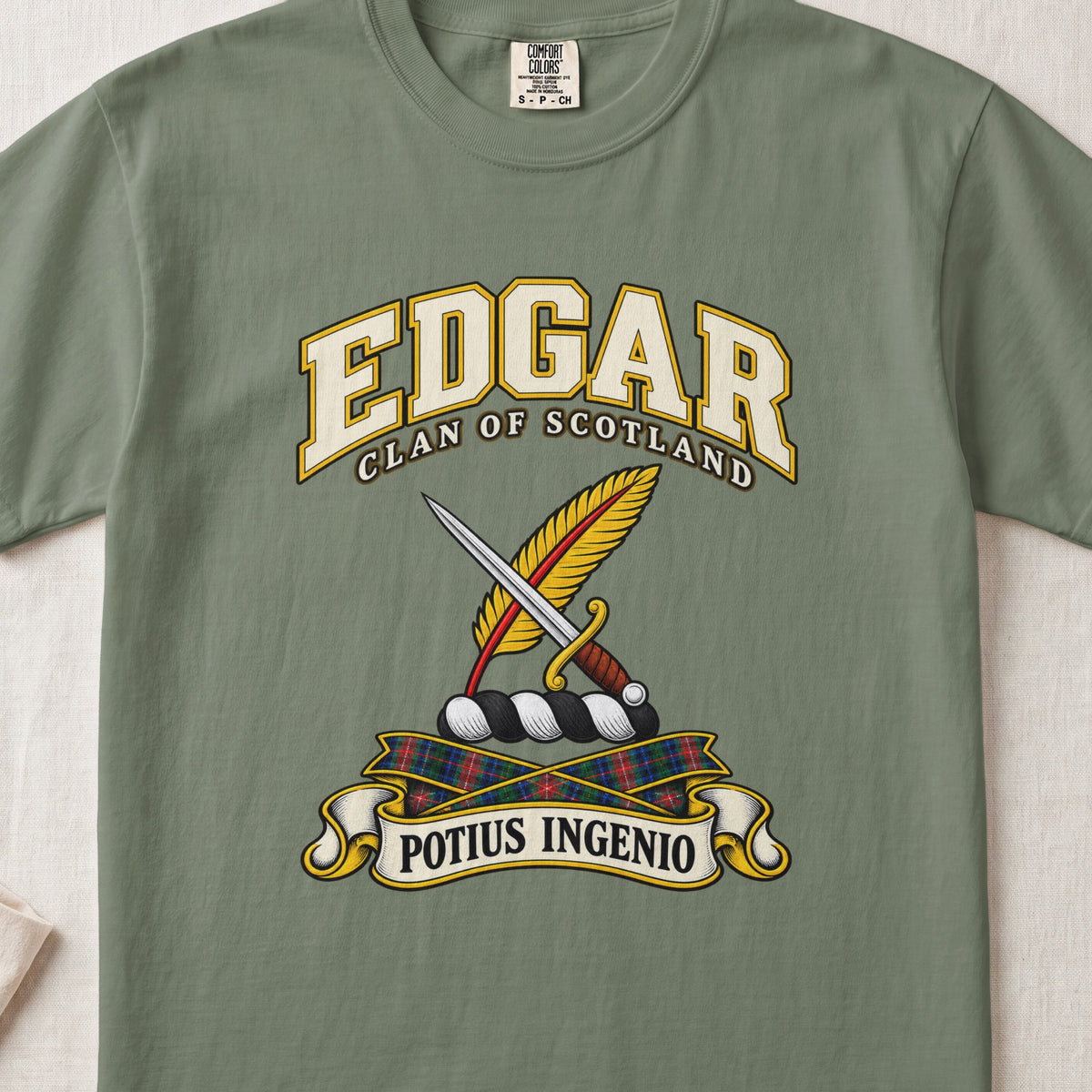 Edgar Scottish clan T-shirt in Moss, front view with a dagger crossed with a gold feather and motto banner.