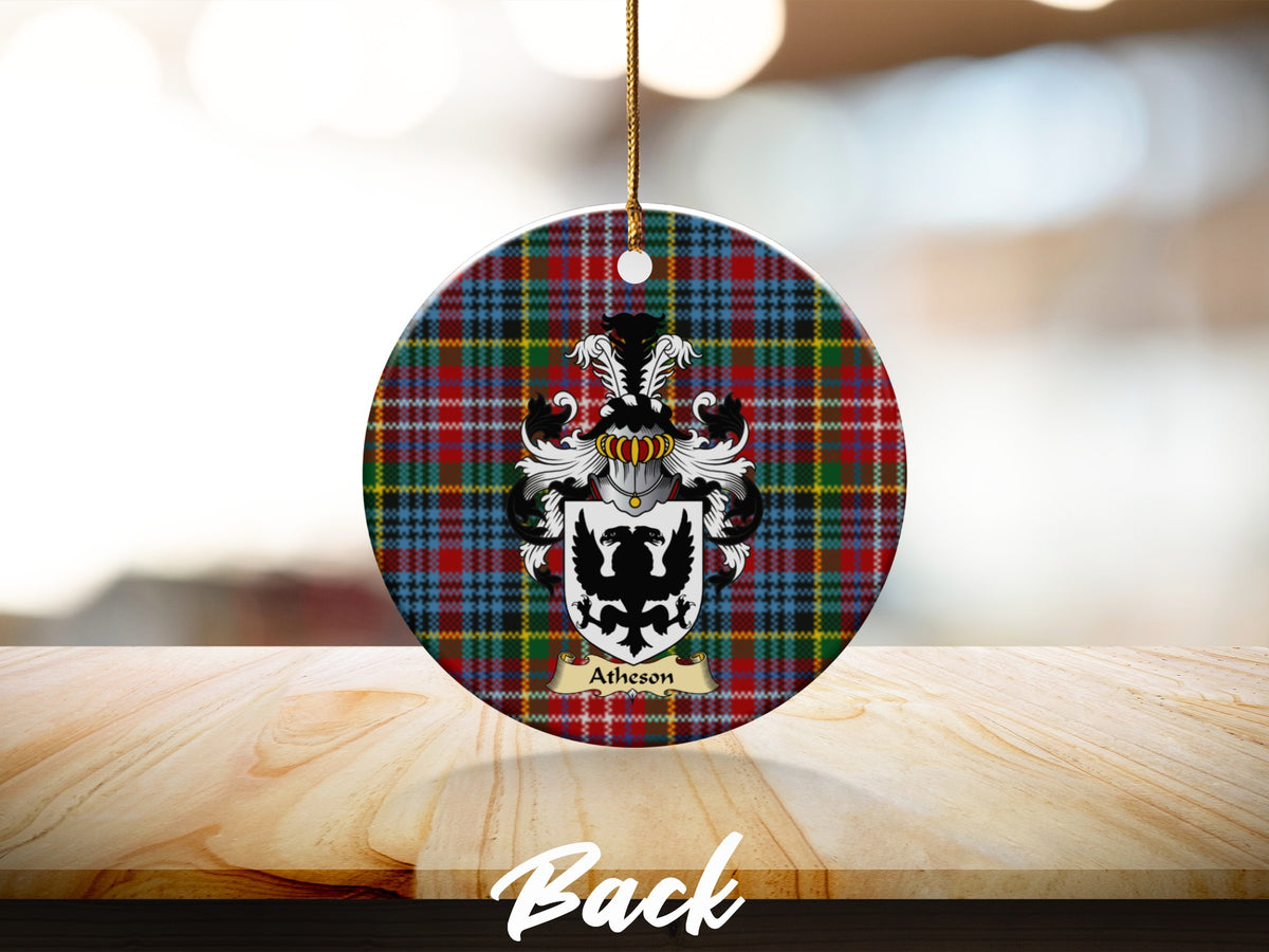 Round Atheson Scottish clan ornament with family crest on a Caledonia tartan background