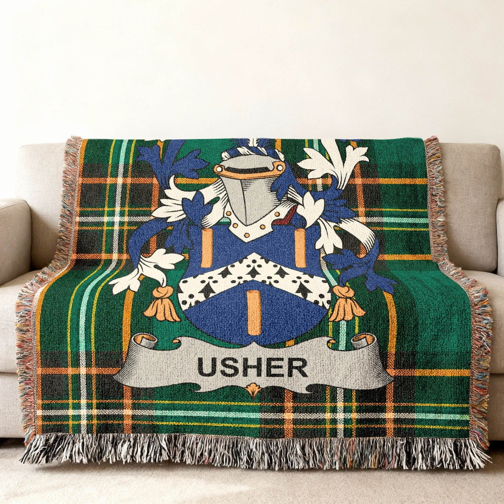 Woven tartan throw blanket with Usher family crest.