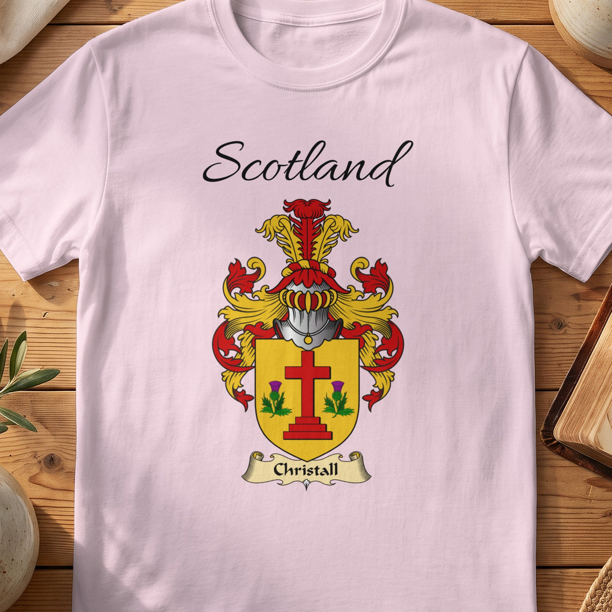 Light Pink Christall Scottish family shield T-shirt featuring a red cross between green sprigs on gold