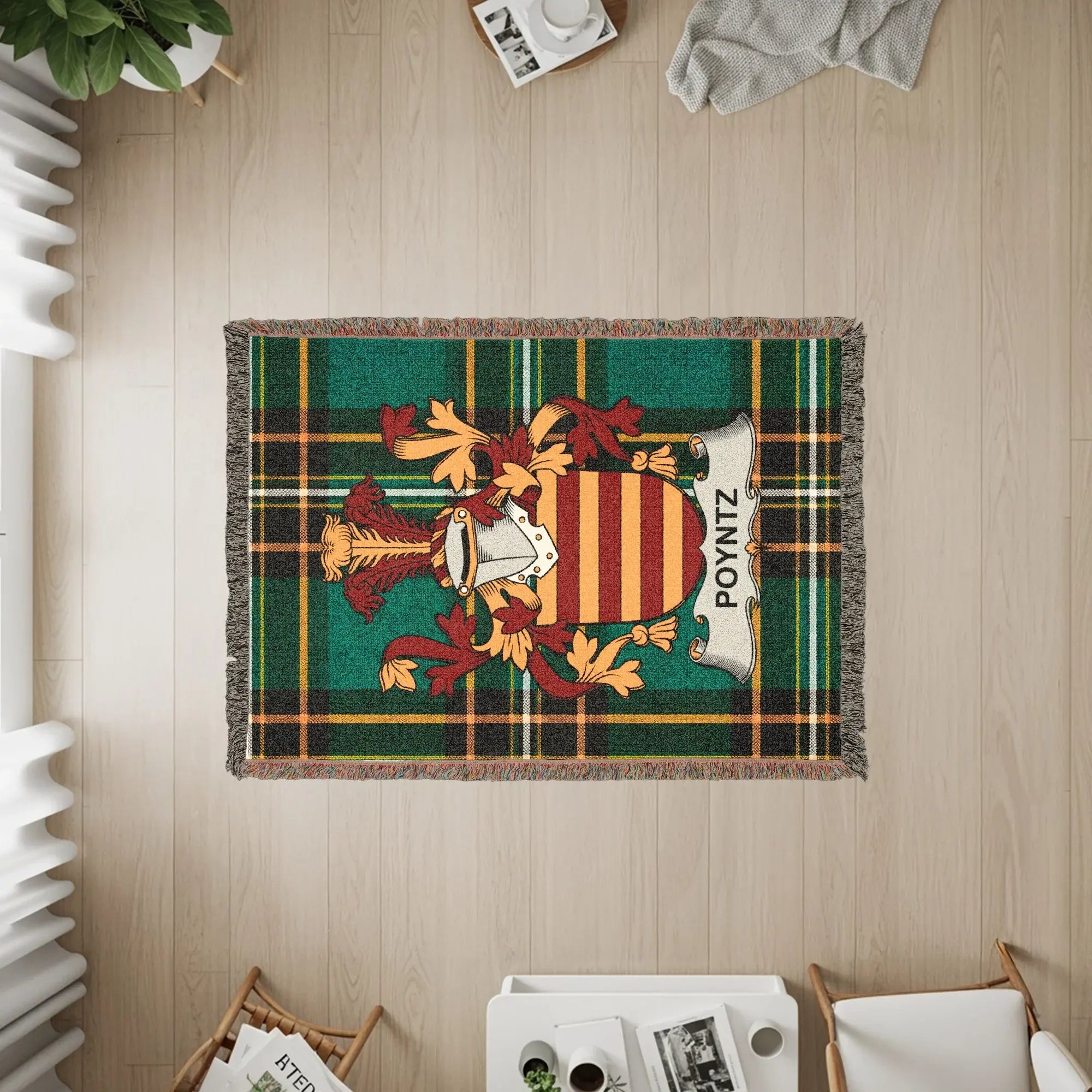 Poyntz family crest on a green and yellow plaid woven blanket.