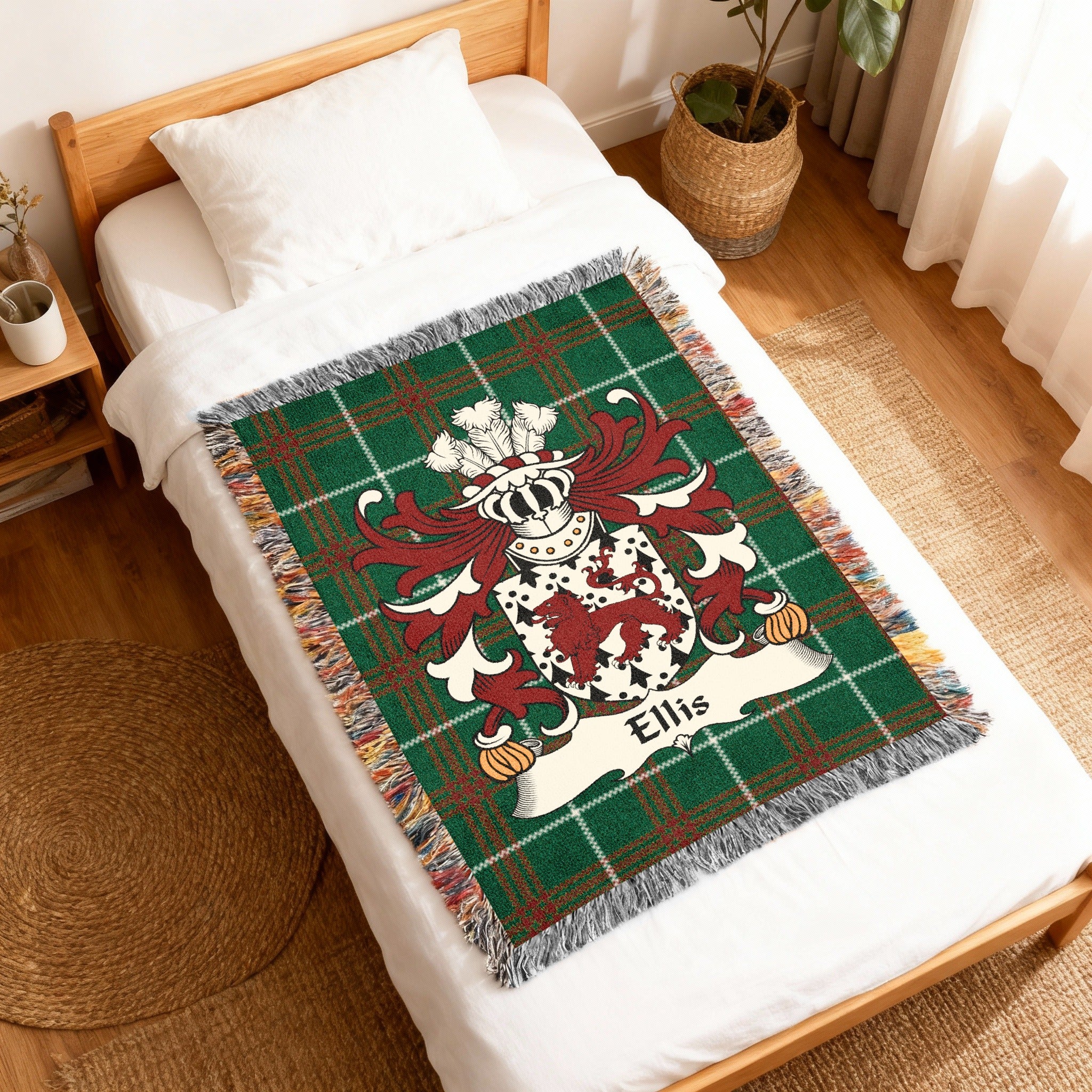 Green plaid woven throw blanket with a crest and the name "Ellis".