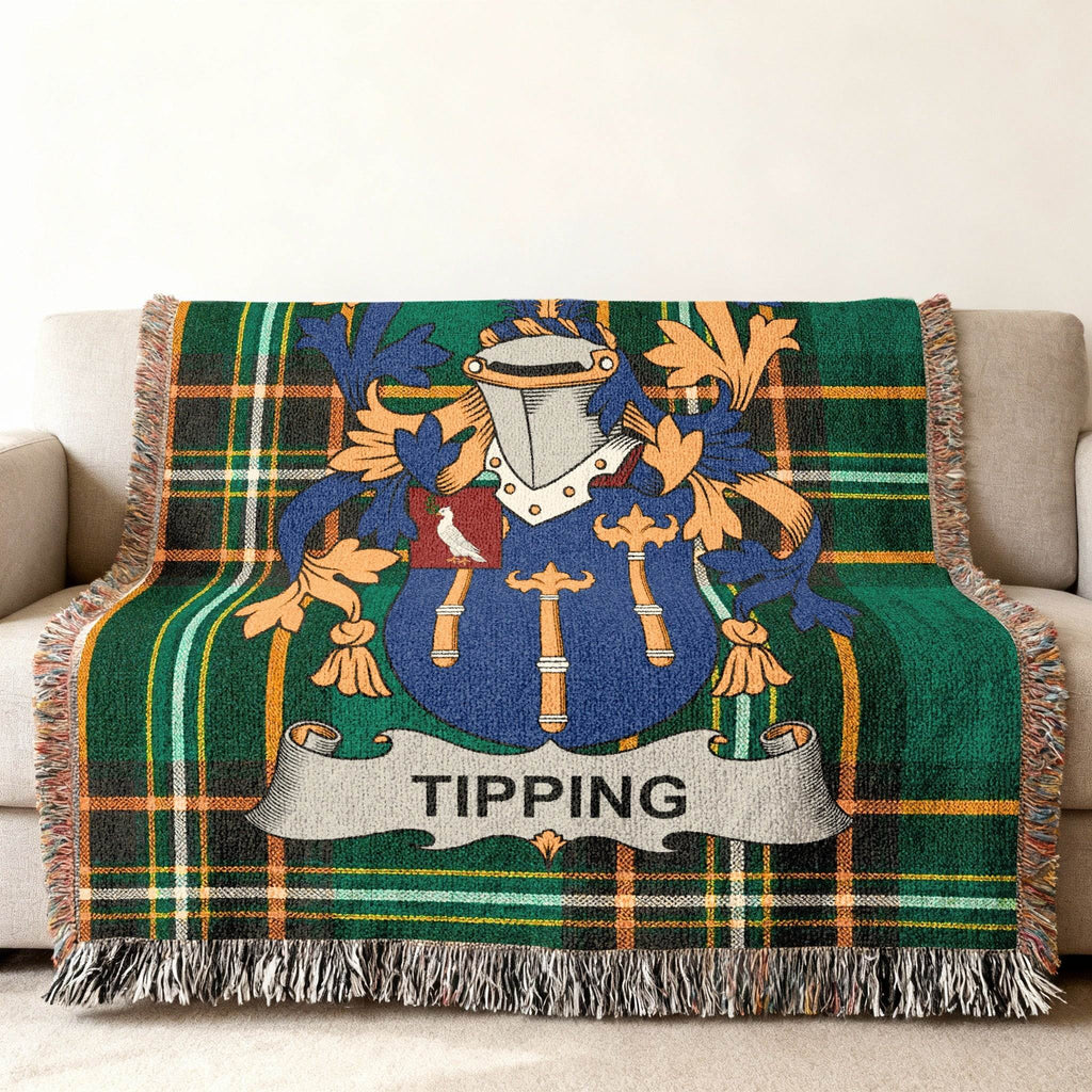 Tapestry throw blanket with the Tipping family crest and plaid pattern.