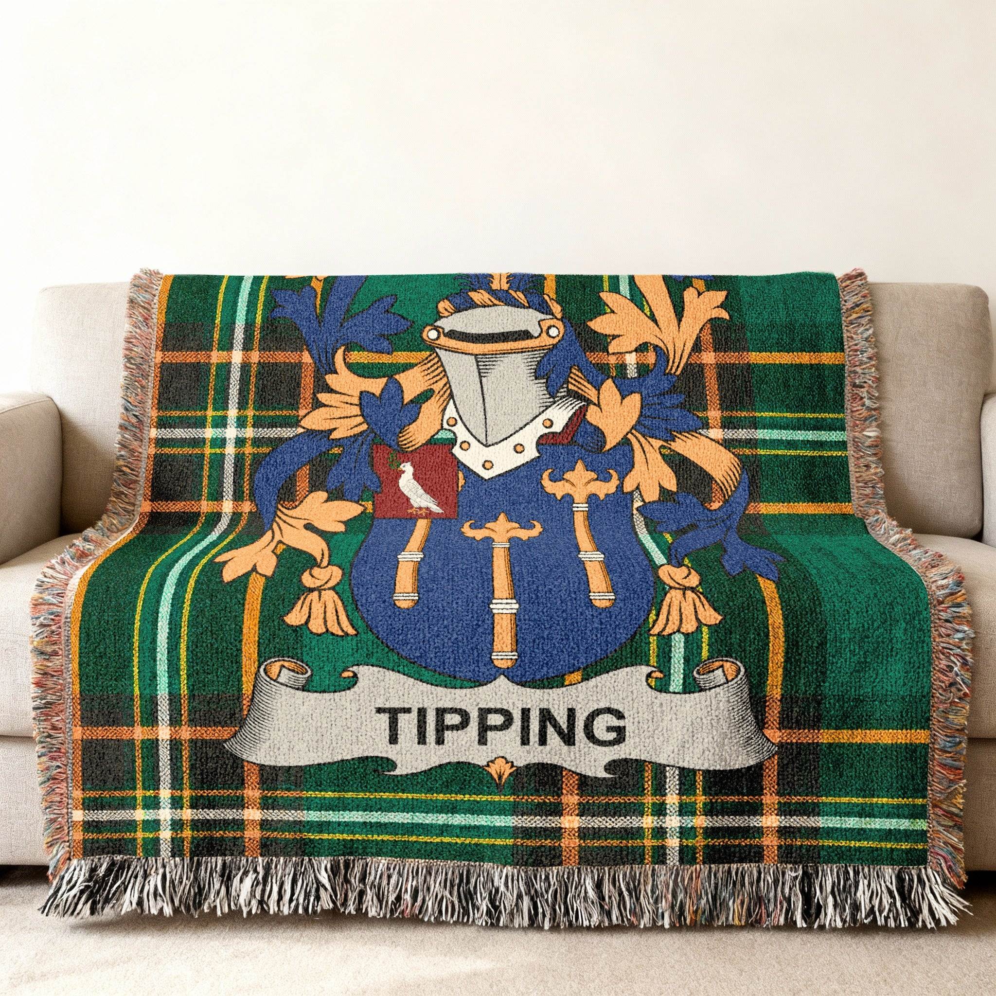 Tapestry throw blanket with the Tipping family crest and plaid pattern.