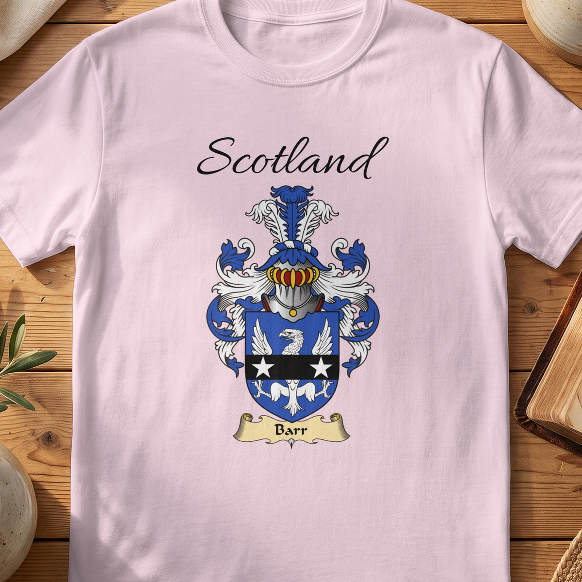 Light Pink Barr Scottish family shield T-shirt featuring a white eagle crossed by a black band with white stars