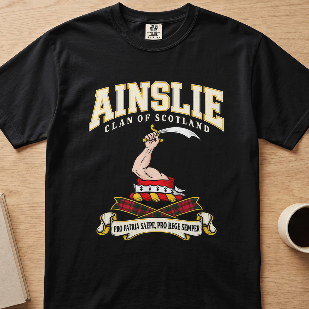 Ainslie raised arm with curved blade graphic on a black Comfort Colors T-shirt, front view