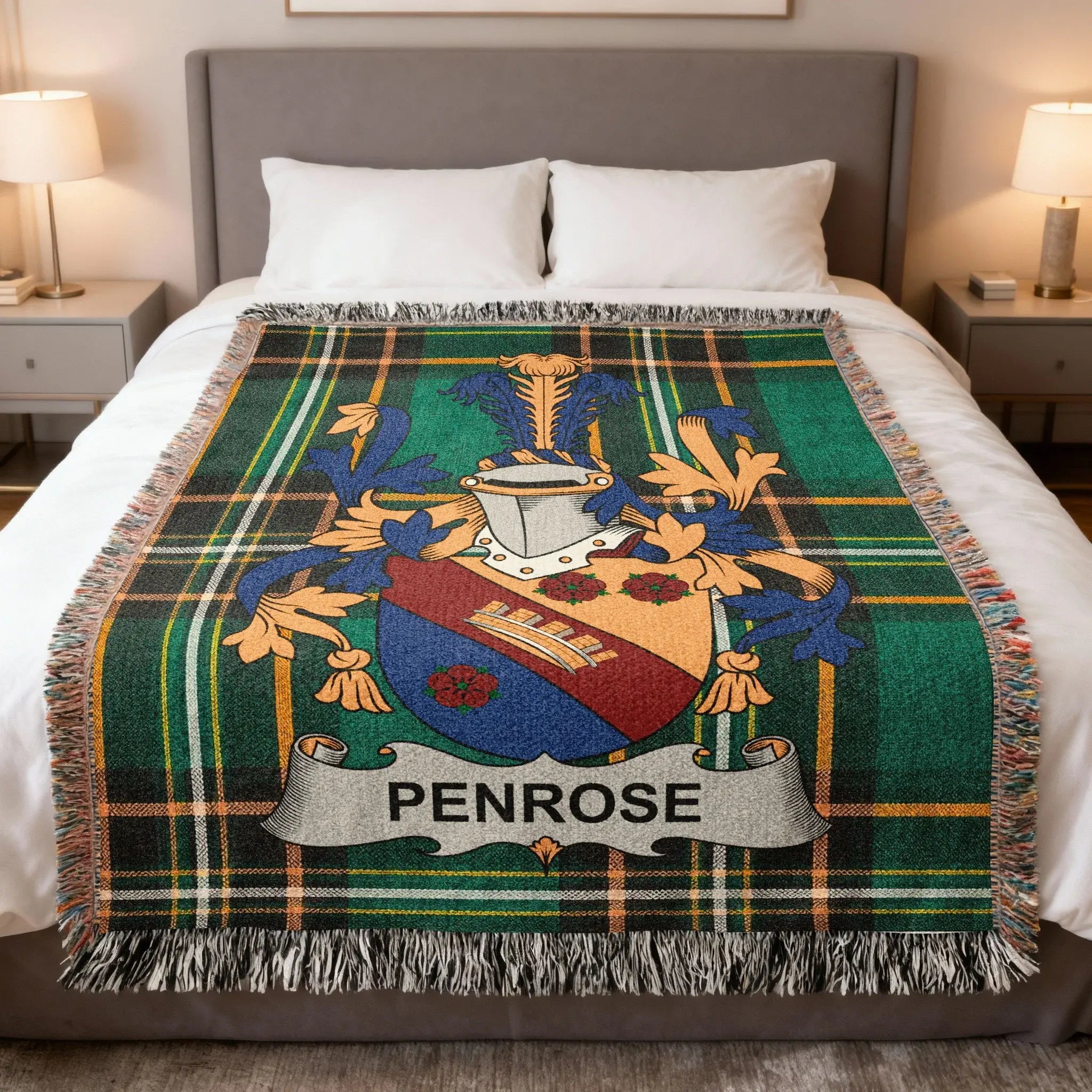 Penrose family crest on a plaid woven throw blanket.