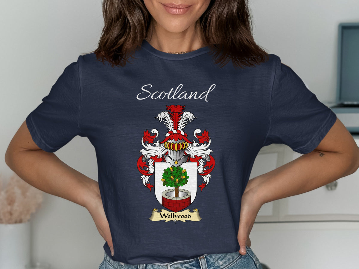 Model wearing the navy Wellwood family crest T-shirt featuring “Scotland” and the surname banner.