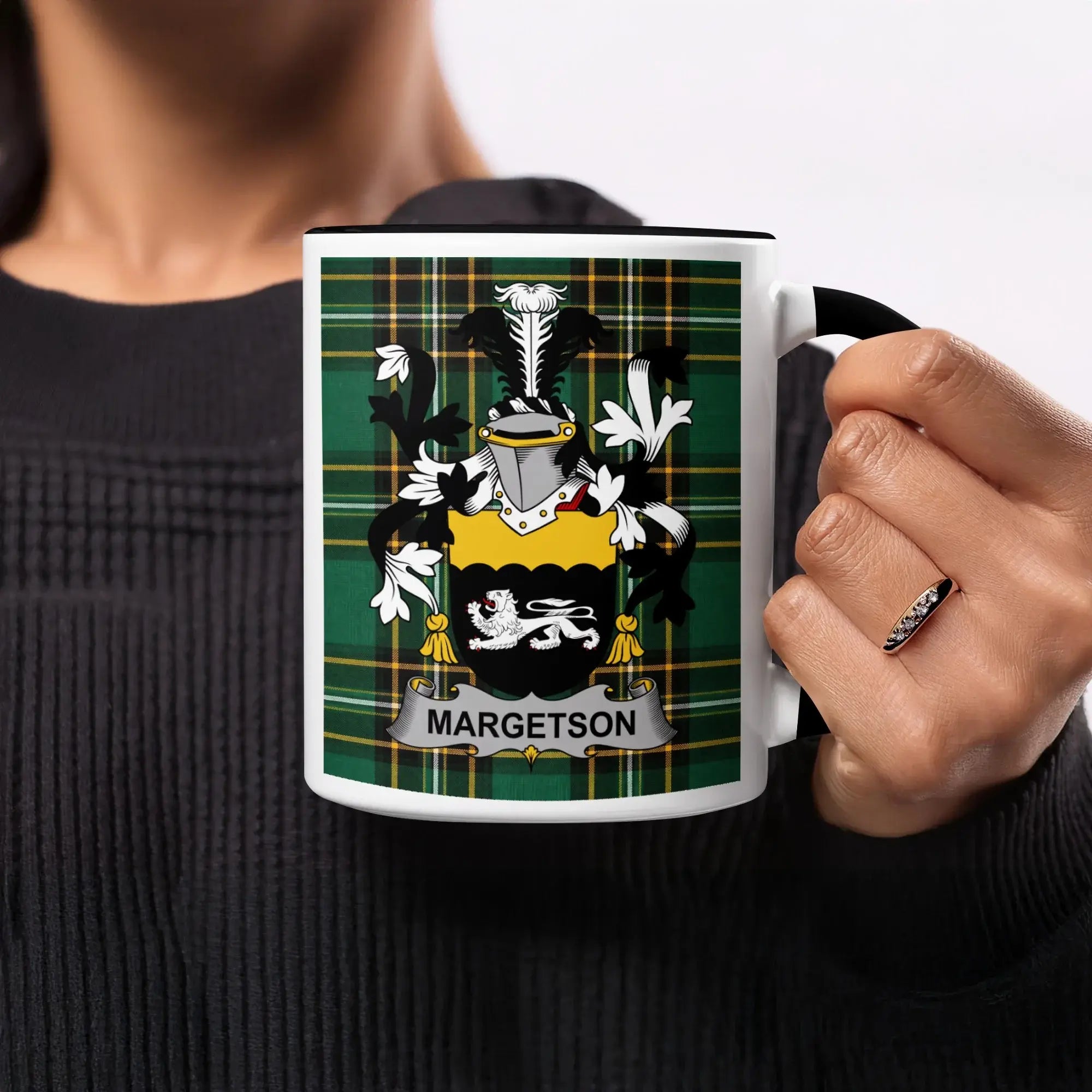 Mug with "MARGETSON" crest on green tartan background.