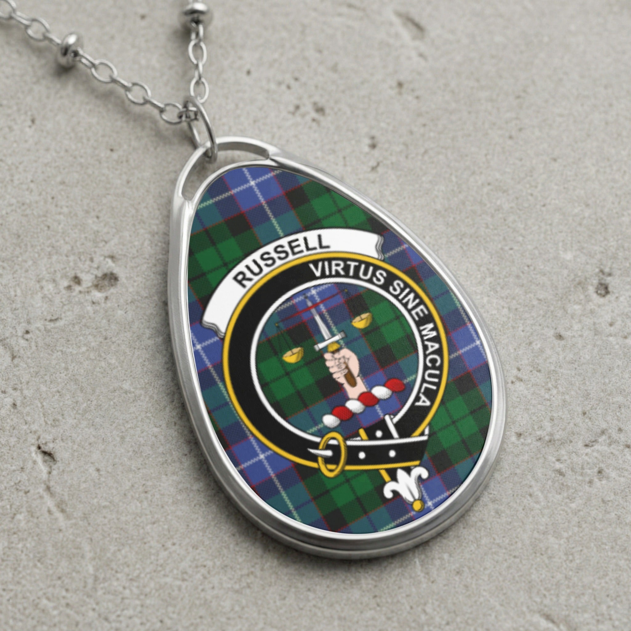 Oval pendant necklace with "RUSSELL VIRTUS SINE MACULA" tartan and crest.