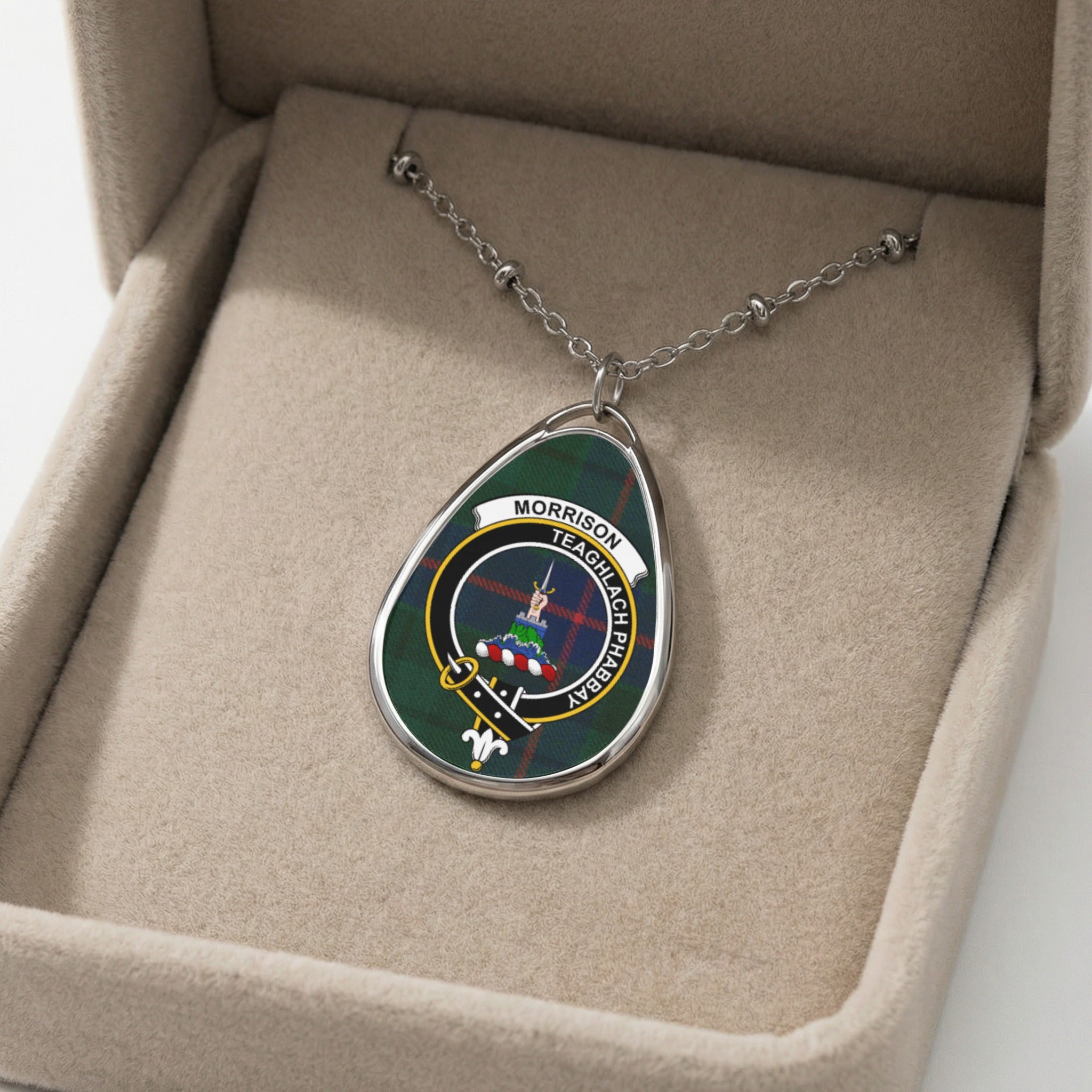Oval pendant necklace with Morrison clan crest on tartan, in velvet box.