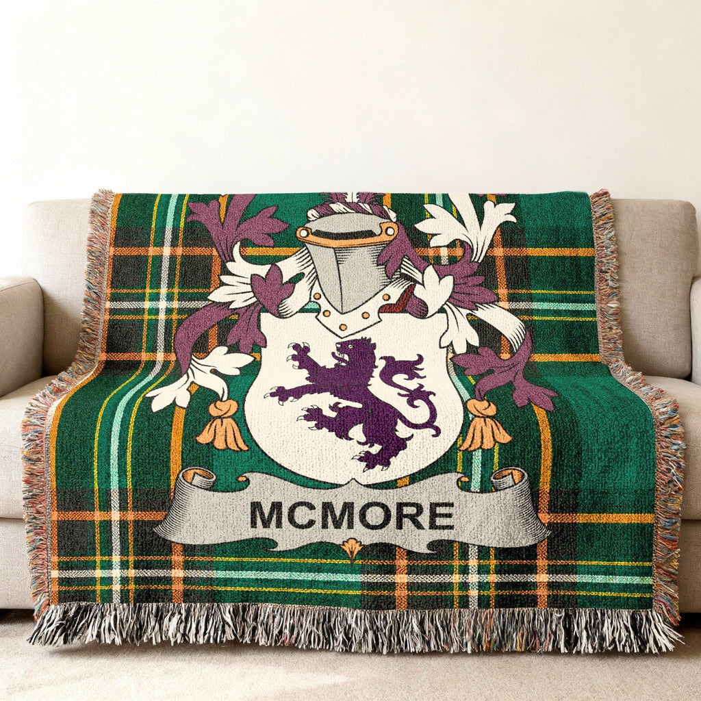 McMore family crest on a green plaid woven throw blanket.