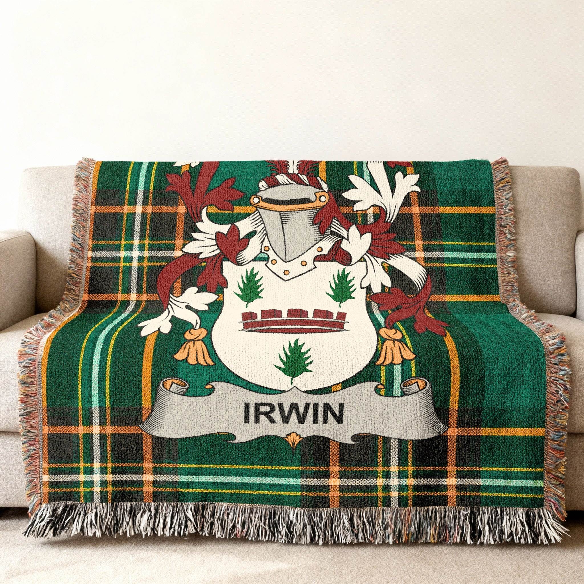 Green tartan blanket with Irwin family crest draped on a couch.