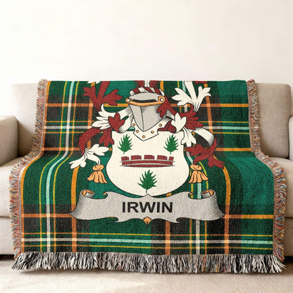 Green tartan blanket with Irwin family crest draped on a couch.